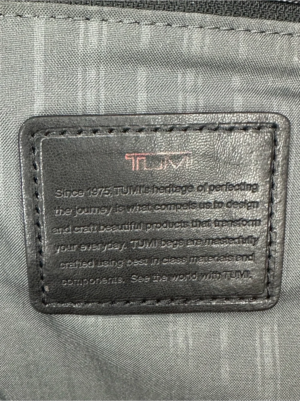Tumi Black Toiletry Bag with Red Accents